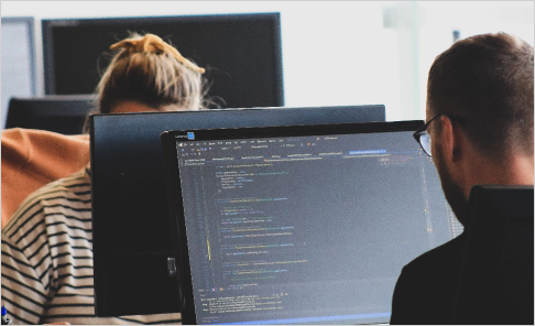 a person working on a desktop monitor